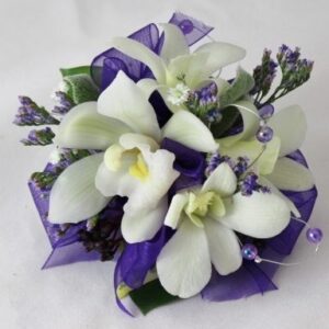 Purples and whites wrist corsage for the ball