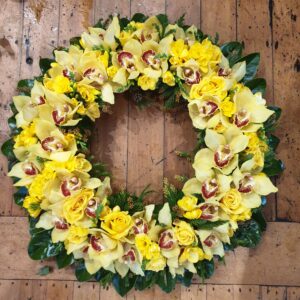 Beutiful Yellow Orchids & Roses Casket Wreath