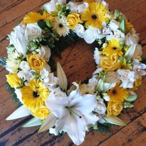 Yellow flowers and white Lily Wreath