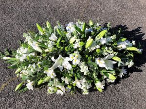 White Lily & White Stock Casket Spray
